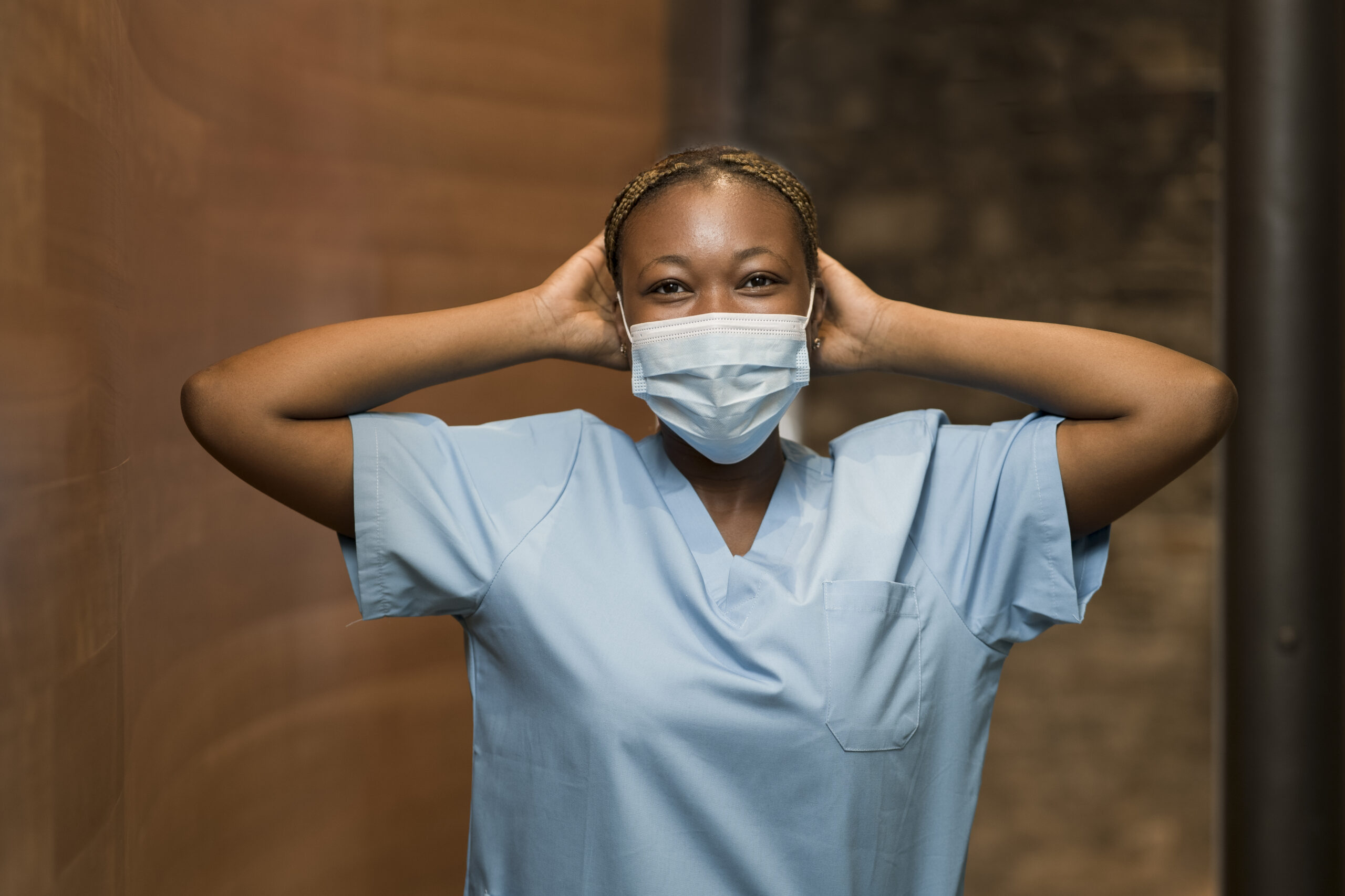 nurse-wearing-scrubs-medical-mask-clinic