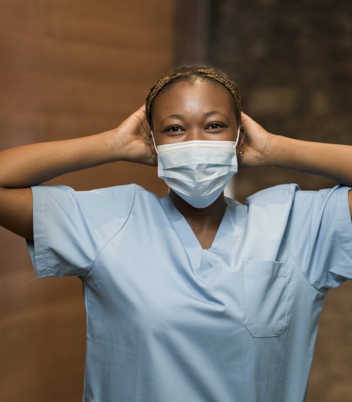 nurse-wearing-scrubs-medical-mask-clinic